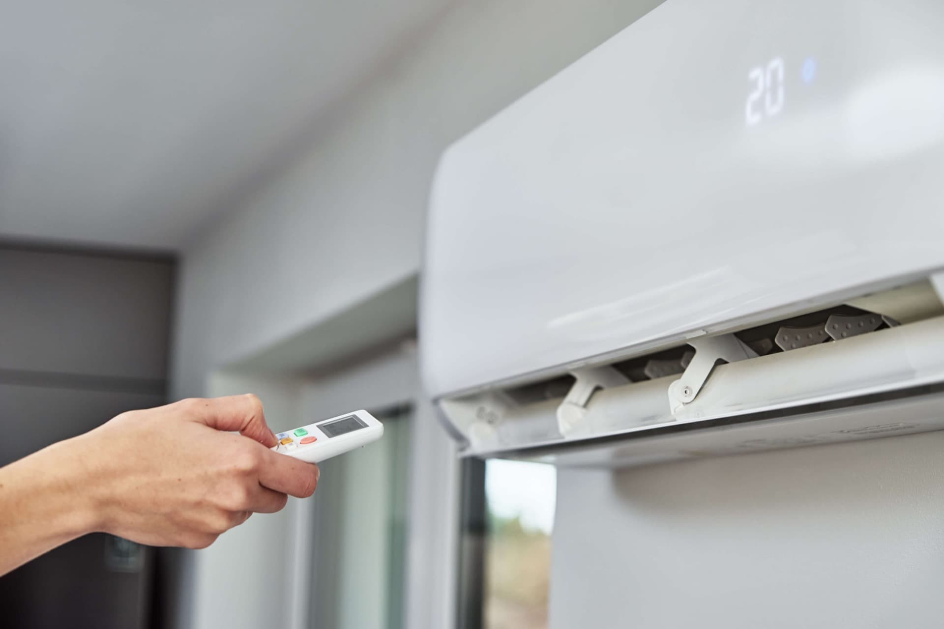 Ductless mini-split indoor unit mounted on a living room wall