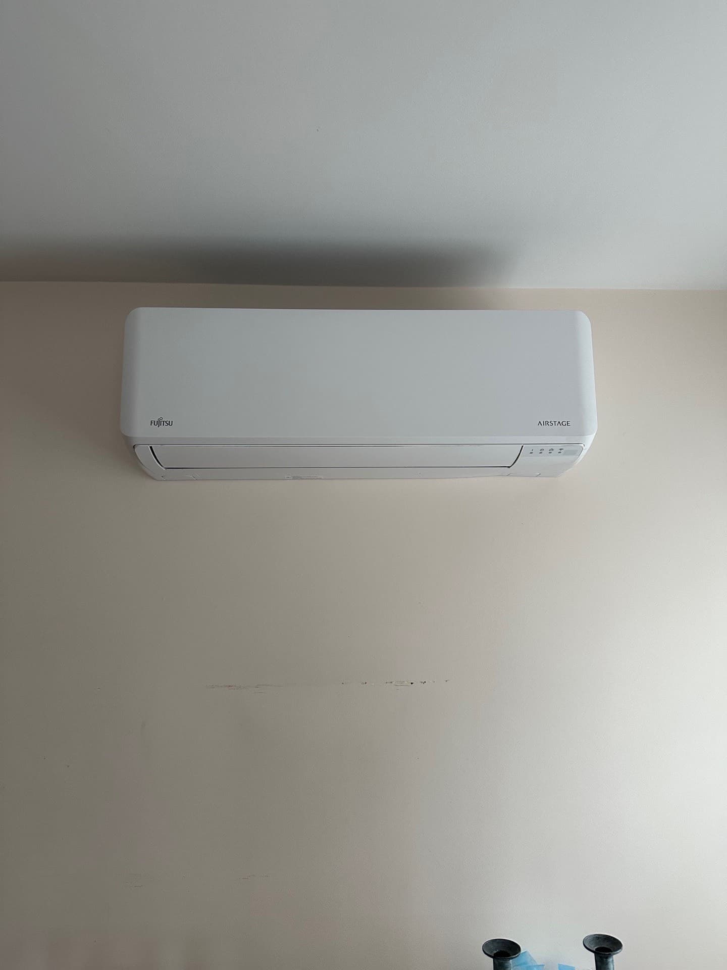 Fujitsu wall-mounted mini-split head in a finished room