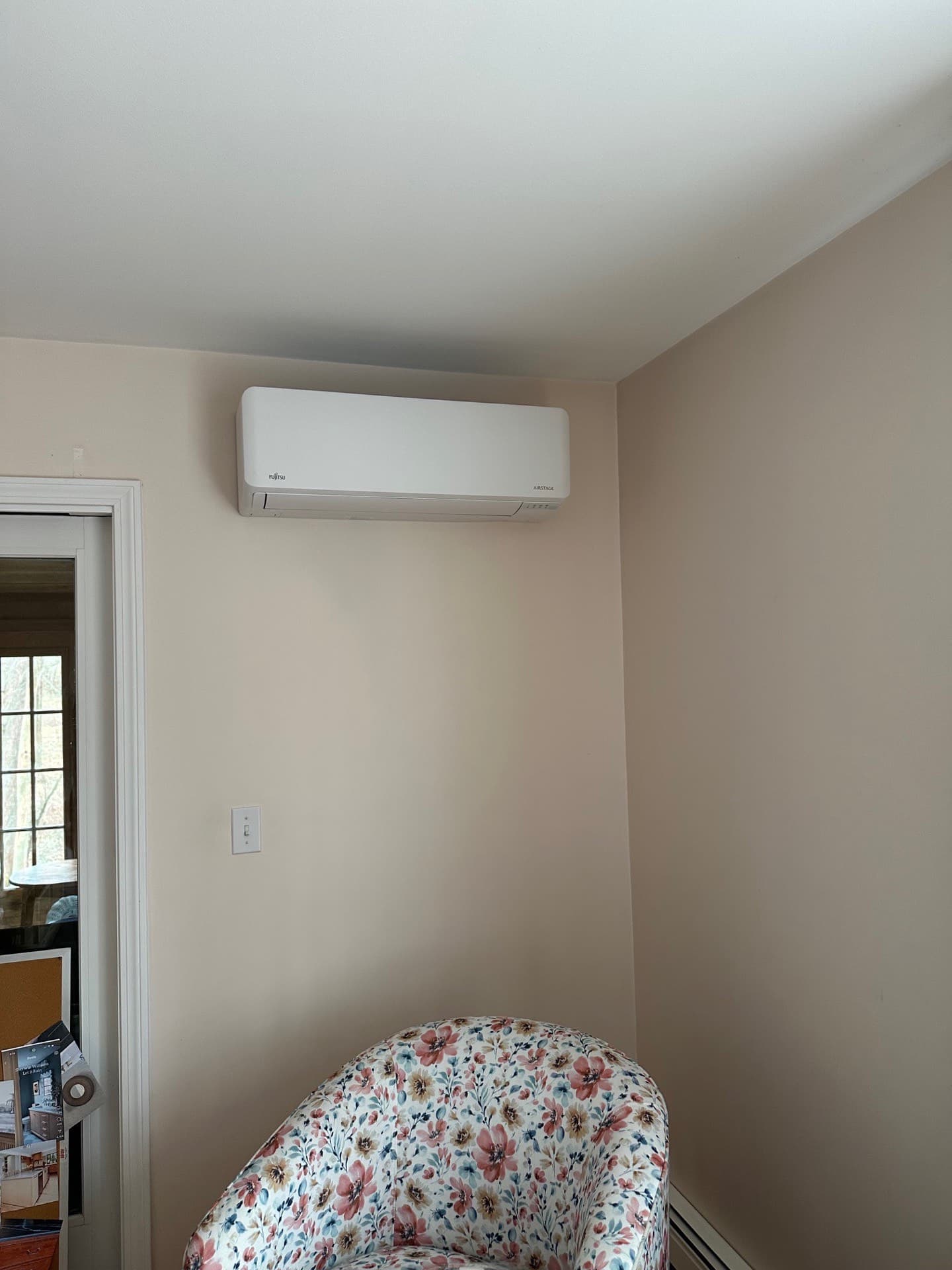 Wall-mounted mini-split head providing zoned comfort in a bedroom