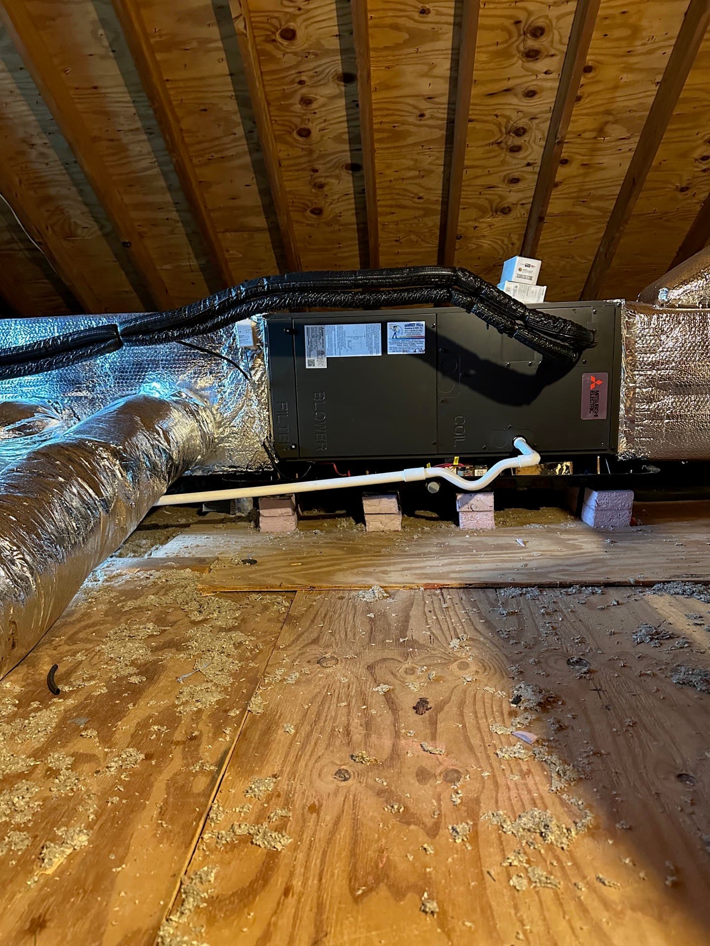 Horizontal air handler and insulated flex duct installed in a crawl space