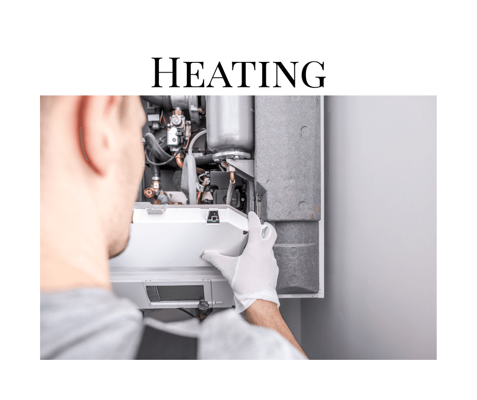 Technician repairing a home heating system before winter